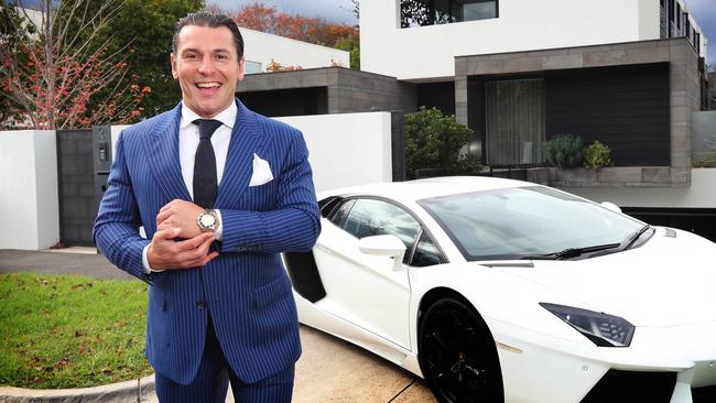 Matthew Pillios is one of the top agents in Victoria. Matthew outside one of his clients houses and cars in Brighton. Picture Rebecca Michael.