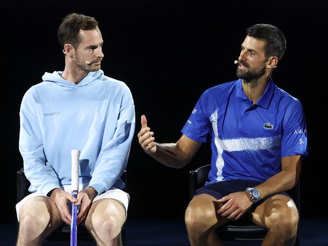 Britainâs Andy Murray (L) reacts with Serbiaâs Novak Djokovic during a charity event titled âNight with Novakâ on Rod Laver Arena in Melbourne on January 9, 2025 ahead of the Australian Open tennis championship starting on January 12. (Photo by DAVID GRAY / AFP) / -- IMAGE RESTRICTED TO EDITORIAL USE - STRICTLY NO COMMERCIAL USE --