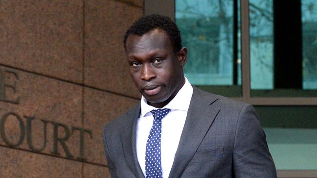 Former AFL footballer Majak Daw leaves the Melbourne Magistrates’ Court. Picture: Andrew Henshaw