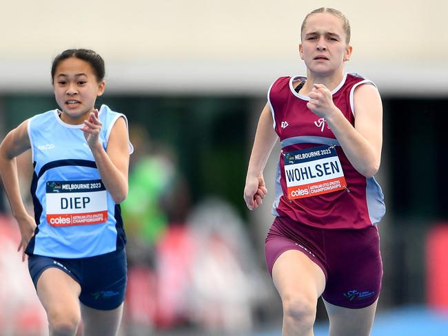 Elysse Diep (NSW), Acacia Wohlsen (QLD) and Rebecca Hvalica (VIC) compete in the Girls U14 100m during the Australian Little Athletics Championships at Lakeside Stadium in Albert Park, Victoria on April 23, 2023.