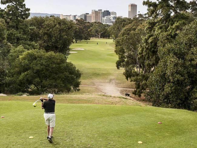 HOT WEATHER PHOTO - regular golfers tee off on the third hole at North Adelaide Golf Course, Friday, November 10, 2017 (overcast 23degrees at 7.35) - pic AAP/MIKE BURTON