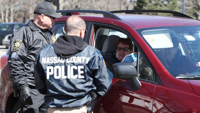 Nassau County police lead a donation drive to collect medical equipment such as N95 surgical masks, nitrile gloves, tyvex suits, antibacterial and disinfecting wipes to battle the coronavirus pandemic in East Meadow, New York. Picture: Getty