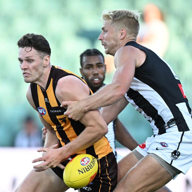 Adelaide, Australia. 03rd June, 2023. Conor Nash of the Hawks is tackled by  Dan Houston and Riley Bonner of the Power during the AFL Round 12 match  between the Port Adelaide Power