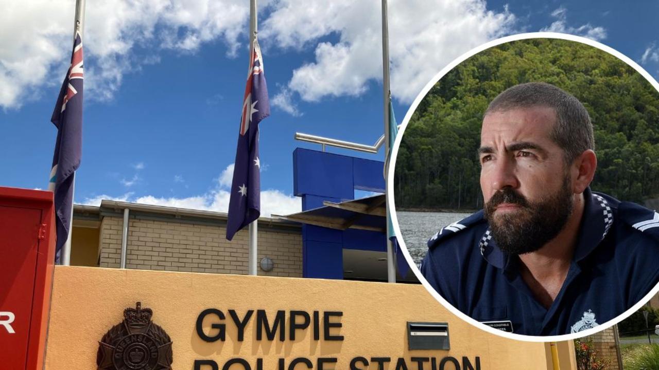 Imbil police station officer in charge Sergeant Bill Greer (inset) has opened up about the horrific events at Wiembilla where two officers and a civilian were murdered in cold blood, while Gympie's police station is flying flags at half mast and bouquets have been placed outside.