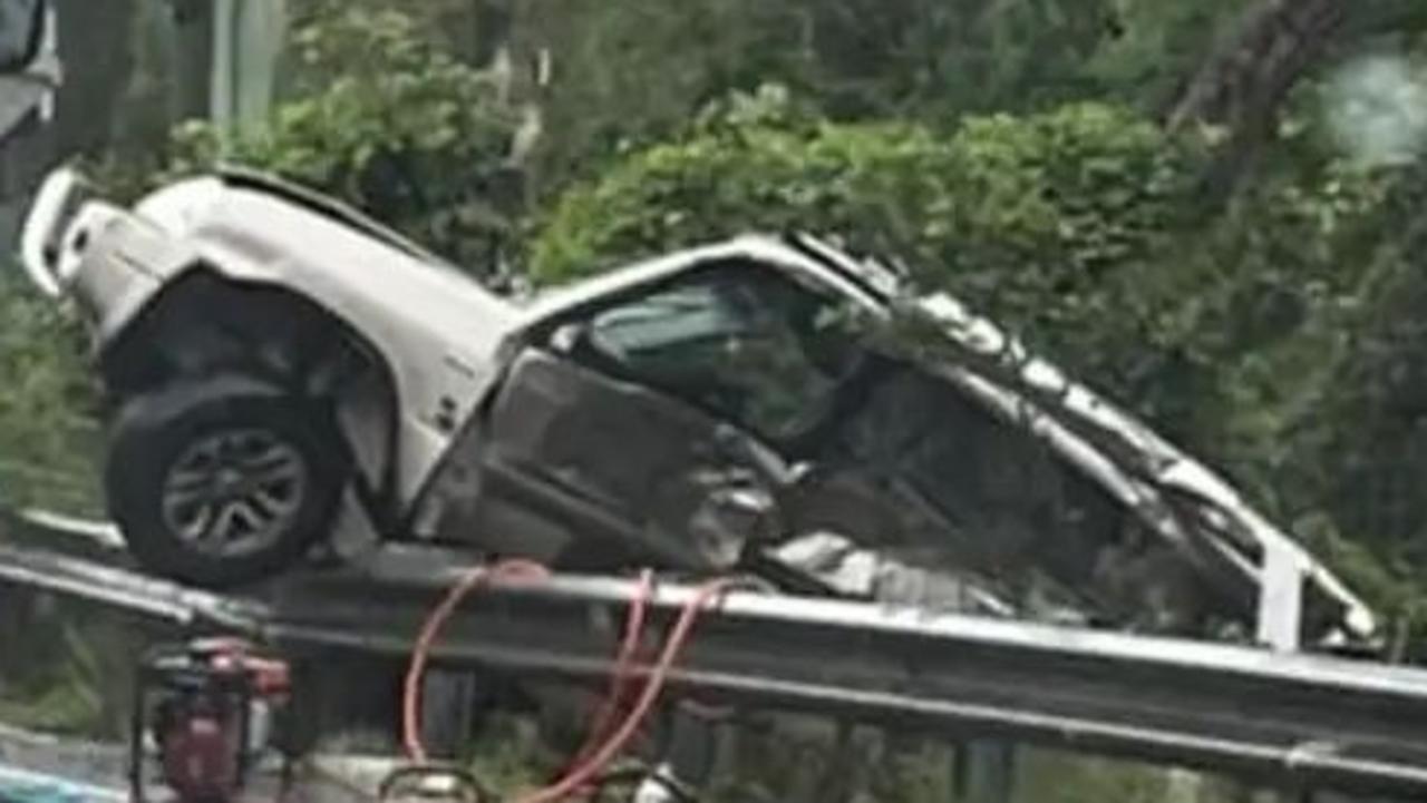 Teen fighting for life after horror rollover, Moggill Rd closed