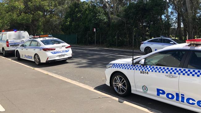 Police vehicles outside the Andrew 'Boy' Charlton Swim Centre at Manly. Picture: Julie Cross