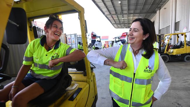 Queensland Premier Annastacia Palaszczuk (right) elbow-bump forklift driver Tracey Manson during a visit to ACFS Port Logistics at the Port of Brisbane in October 2020. Picture: NCA NewsWire / Dan Peled