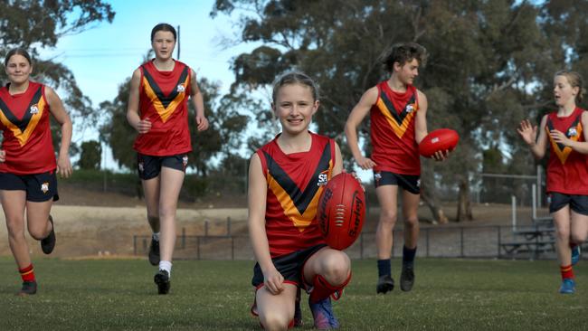 SA girls players Scarlett Kelly, Lara Gribbin, and Jaiya Thornton with boys representatives Harrison Webb and Hunter Fieldhouse. Picture: Dean Martin