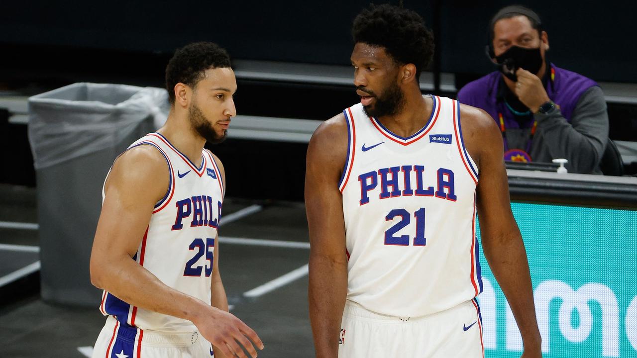 (FILES) In this file photo taken on February 12, 2021 Ben Simmons #25 and Joel Embiid #21 of the Philadelphia 76ers talk during the NBA game at Phoenix Suns Arena on February 13, 2021 in Phoenix, Arizona. - Philadelphia 76ers star Joel Embiid on September 1, 2021 denied reports of a rift with team-mate Ben Simmons amid reports that the Australian star is seeking to leave the franchise. (Photo by Christian Petersen / GETTY IMAGES NORTH AMERICA / AFP)