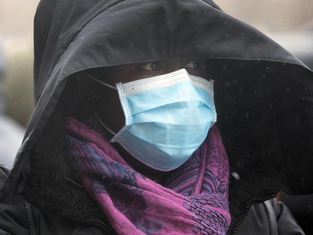 People across the US are now being urged to wear masks. Picture: AP Photo/Michael Dwyer.