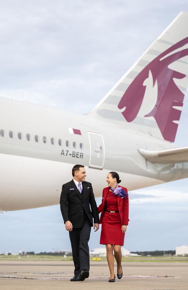 Crew from Virgin Australia stand beside a Qatar Airways Boeing 777. Picture: Getty Images