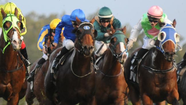 Monsieur Gustave (green colours) storms past Federal to win the Eye Liner Stakes at Ipswich, June 17 2017. Grant Peters, Trackside Photography.