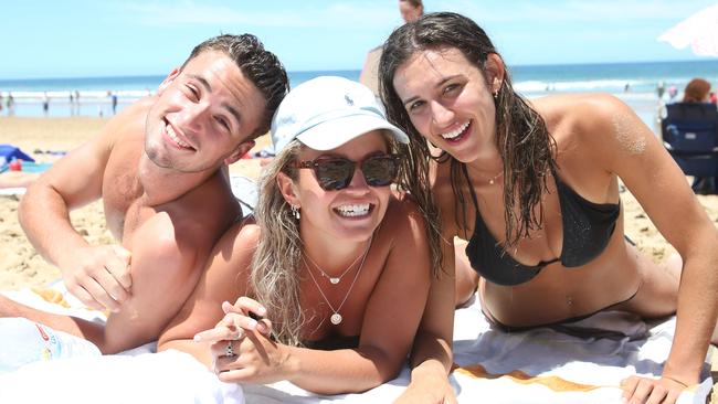 Cam Ralph, Annie Pettist and Tessa Donnithorne escape the heat at Jan Juc on Sunday. Picture: Alan Barber