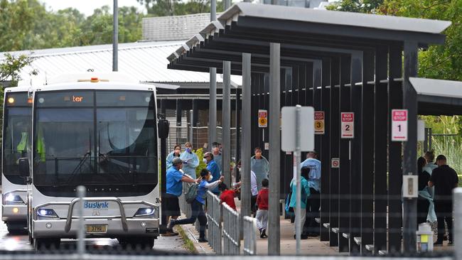 Buses deliver the first Australian evacuees from Wuhan to the former Inpex workers’ camp in Howard Springs earlier this month. Picture: Che Chorley