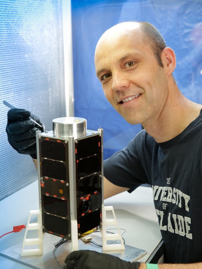 Dr Matt Tetlow and the QB50 CubeSat now in space. Picture: Russell Millard