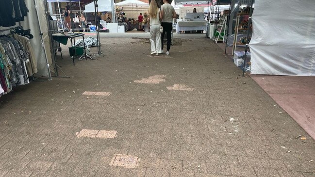 The splotches on the ground used to have numbers and lettering denoting where stalls should go.