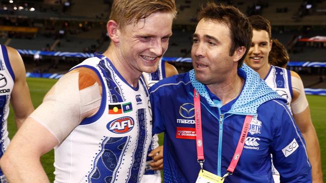 Brad Scott and Kangaroos star Jack Ziebell in 2019. Scott stepped down as coach midway through the season and is currently the head of AFL Victoria.