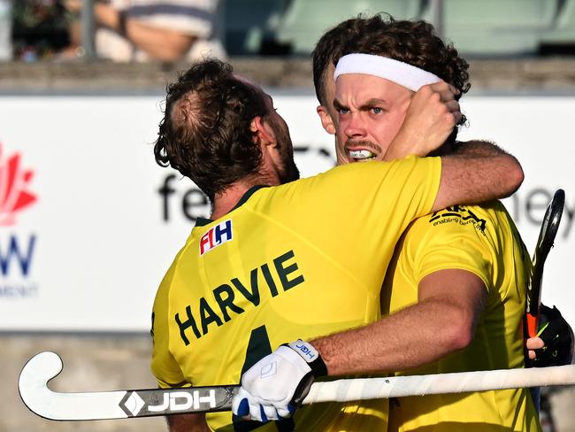 Australiaâs Cooper Burns (R) celebrates his goal with teammates during the men's field hockey match between Australia and the Netherlands in the FIH Hockey Pro League in Sydney on February 6, 2025. (Photo by Saeed KHAN / AFP) / -- IMAGE RESTRICTED TO EDITORIAL USE - STRICTLY NO COMMERCIAL USE --