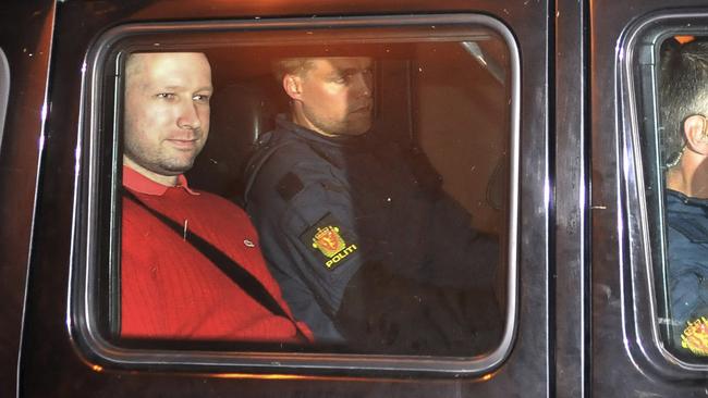 Anders Behring Breivik, left, sits in an armoured police vehicle after leaving a court hearing in Oslo, Norway in July 2011. Picture: AP