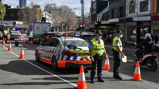 Officers check on traffic heading into the city. Picture: NCA NewsWire/Flavio Brancaleone