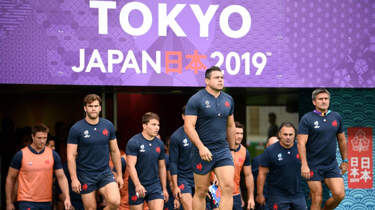 France's players arrive for a training session at the Tokyo stadium in Tokyo.