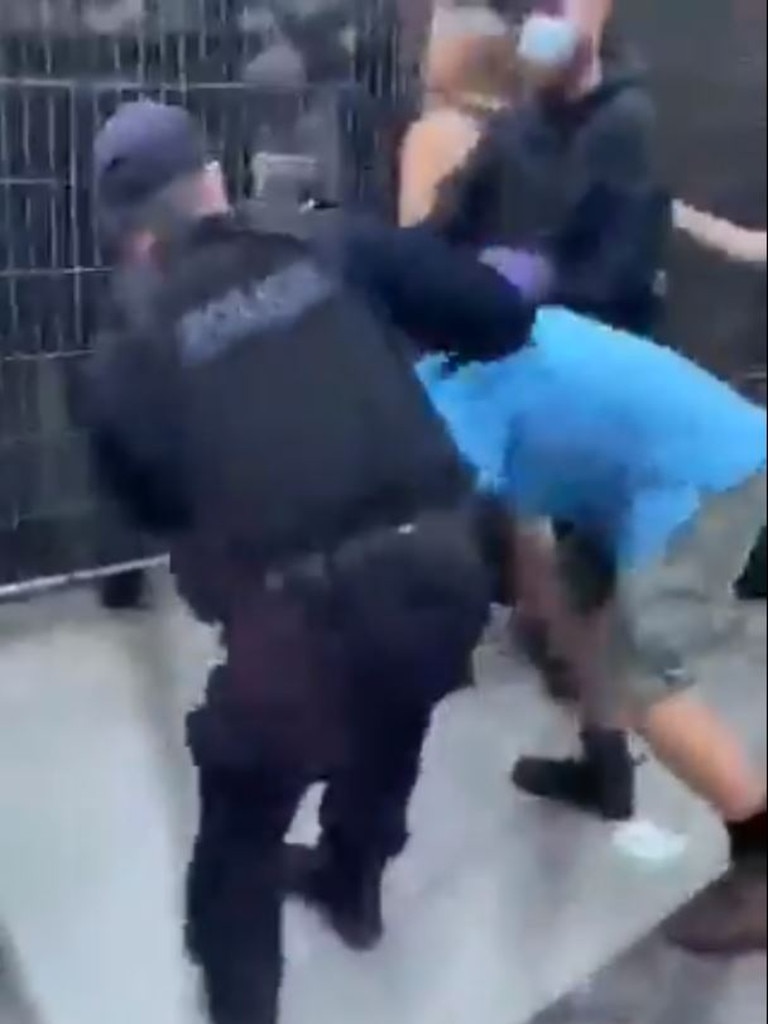 Footage shared on social media appears to show a police officer hitting a protester at Kangaroo Point from behind. Police say they are reviewing the footage.