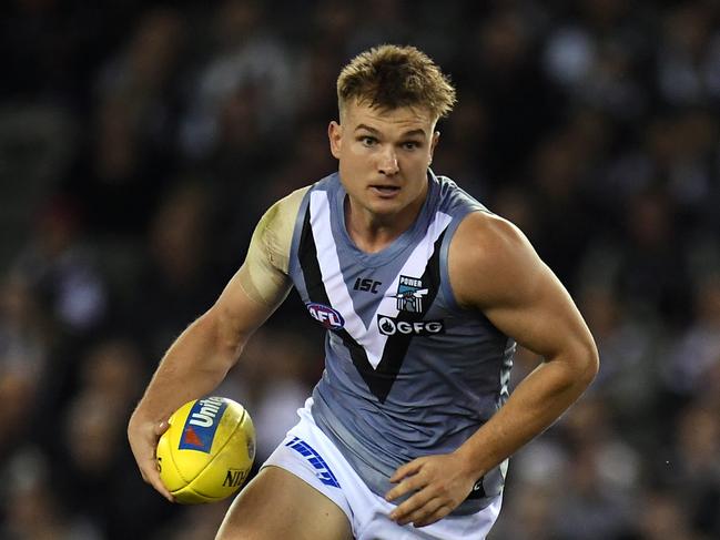 Ollie Wines of the Power is seen in action during the Round 7 AFL match between the Collingwood Magpies and the Port Adelaide Power at Marvel Stadium in Melbourne. AAP Image/Julian Smith