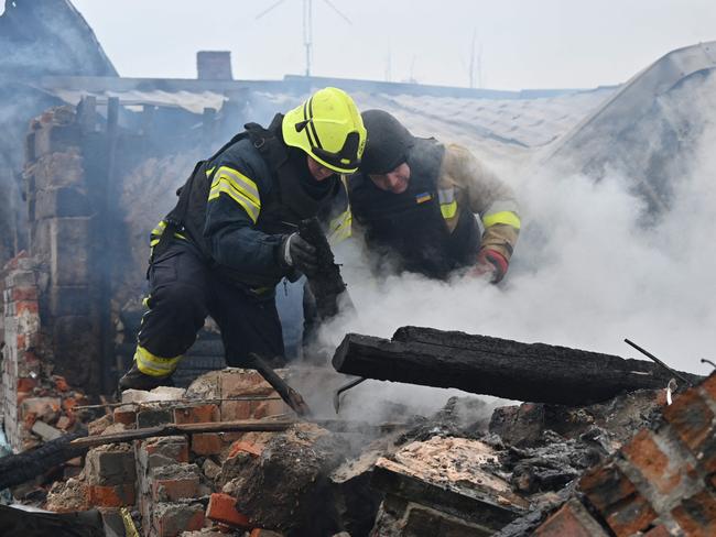 Rescuers of the State Emergency Service work to put out a fire in a private house after a drone strike in Kharkiv, on December 25, 2024. Picture: AFP