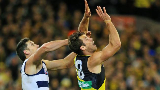 Alex Rance flies for a mark against Harry Taylor. Picture: Mark Stewart