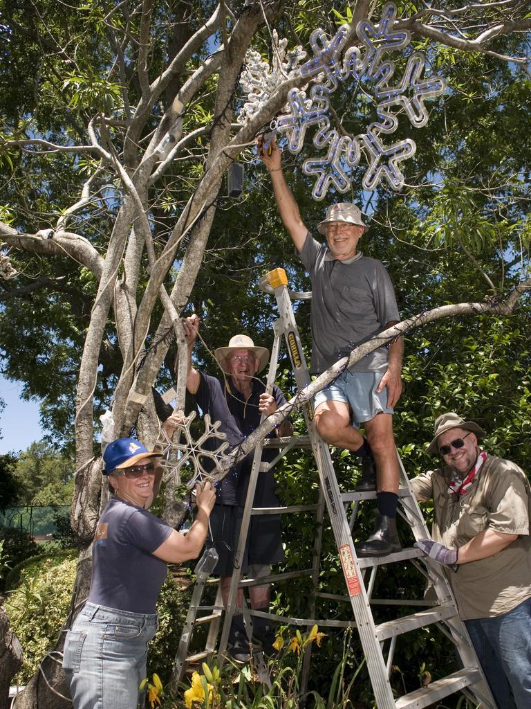 Lions Club of West Toowoomba members and volunteers including (from left) Lesley Henry, Rod Hultgren, Leo Dittman and Johan Human get Queens Park ready for Toowoomba's Christmas Wonderland, Monday, November 25, 2013. Photo Kevin Farmer / The Chronicle