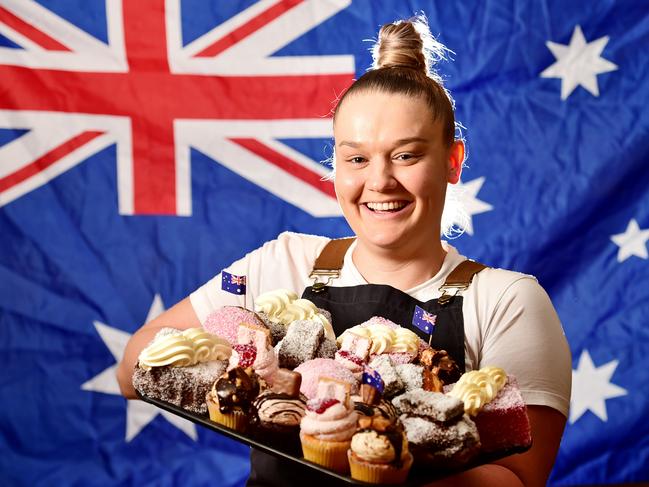 Chloe Kelly, baker and inventor of Otto's Australia Day treats. Chloe with a range of Iced Vovo Cupcakes, Lamington Donuts and Golden Gaytime Cupckaes. Picture: Alix Sweeney