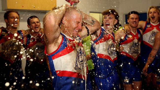 Shane Harvey cops a shower in North Heidelberg’s rooms. Picture: Hamish Blair