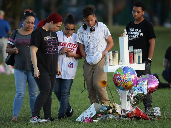 People visit a memorial at Pine Trails Park for the students who were killed. Picture: Mark Wilson