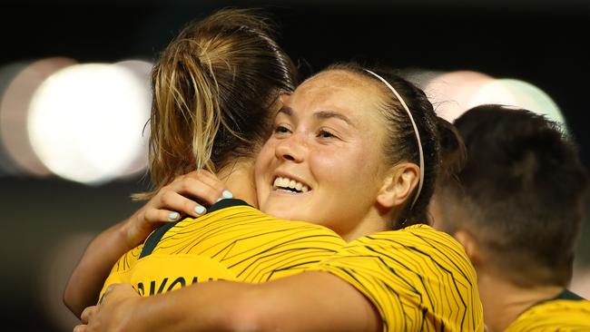 Matildas star Caitlin Foord hugs Emily van Egmond after scoring a goal on Tuesday