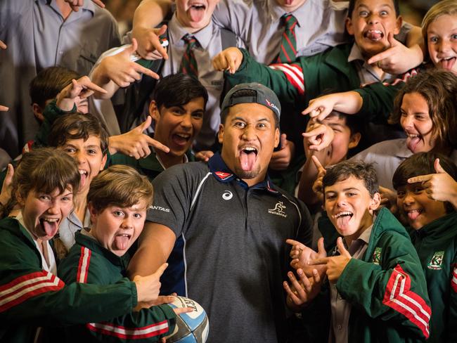 Brandon Paenga-Amosa hams it up with students at Kelvin Grove State College after being named to make his Wallabies debut. Picture: RUGBY.com.au/Stuart Walmsley