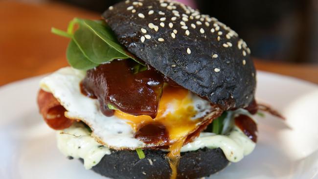 Black magic: Rukus’ lump of coal bacon and egg roll. Picture: Martin Lange