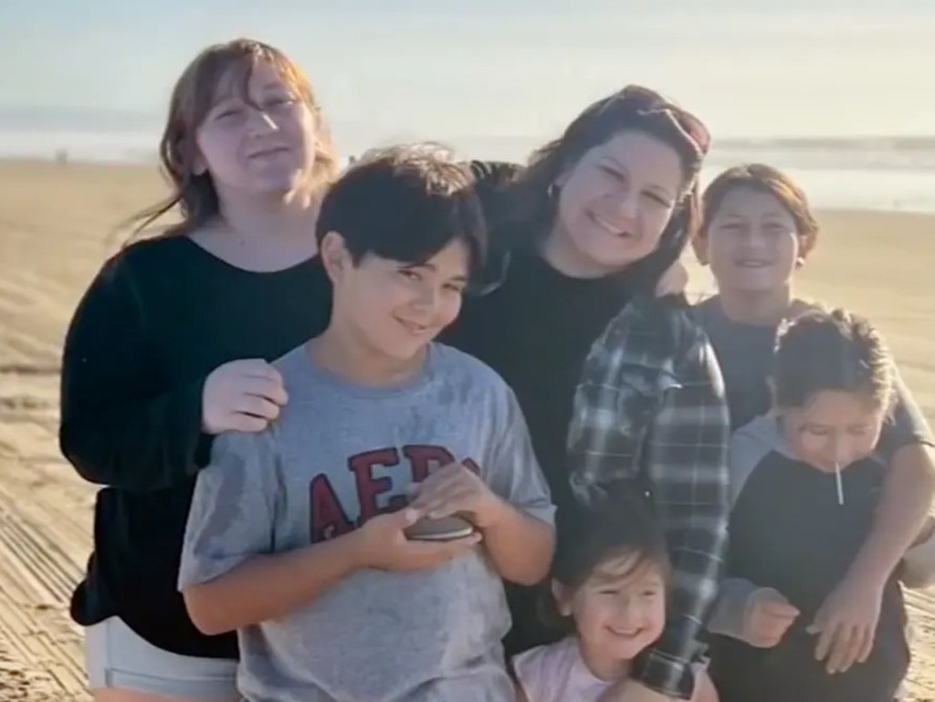 Charlotte Russ (centre) was fined over $133,000 ($US88,000) after her kids mistakenly collected clams on a California beach. Picture: KFSN-TV