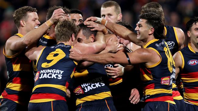 The Crows celebrate Walker’s tenth goal. (Photo by James Elsby/AFL Photos via Getty Images)