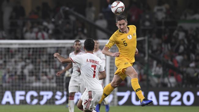 Australian skipper Mark Milligan heads the ball against the United Arab Emirates. Picture: AP