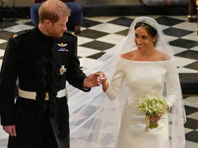 Despite controversy leading up to the big day, the happy couple were all smiles. Picture: AFP