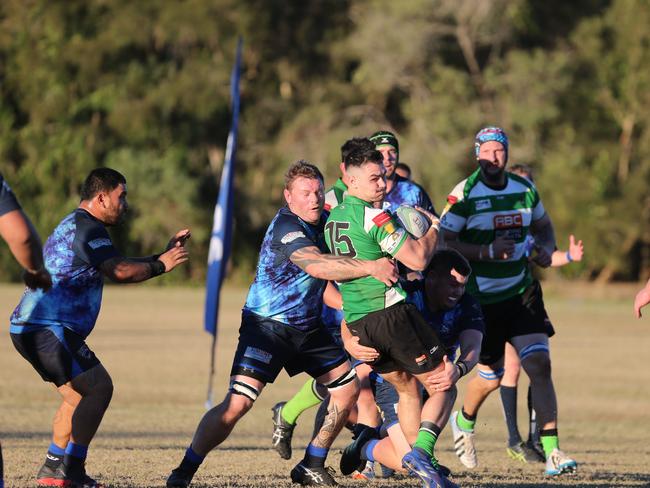 Karl Wernham pictured tackling Palm Beach player Lachie Stewart. Picture: Mike Batterham