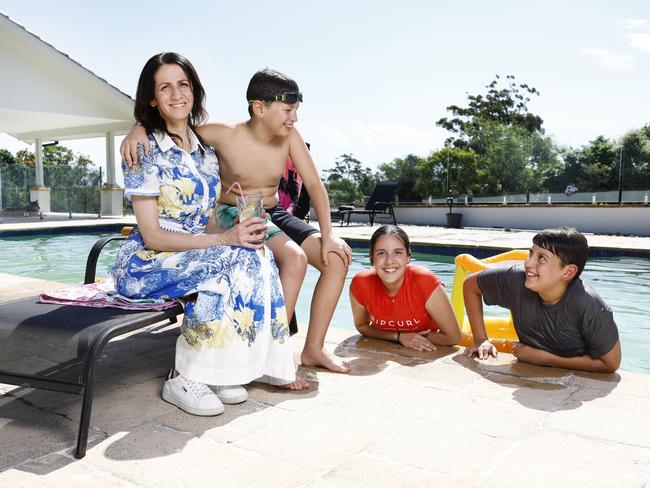 DAILY TELEGRAPH 11TH DECEMBER 2024Pictured at home in Glenorie is Anastasia Massouras with her kids Kayden (9) , Christiana (14) and Michael (12).Anastasia has recently purchased an apartment on the beach where she plans to spend time with her kids but also turn it into an Airbnb for others to enjoy.Picture: Richard Dobson