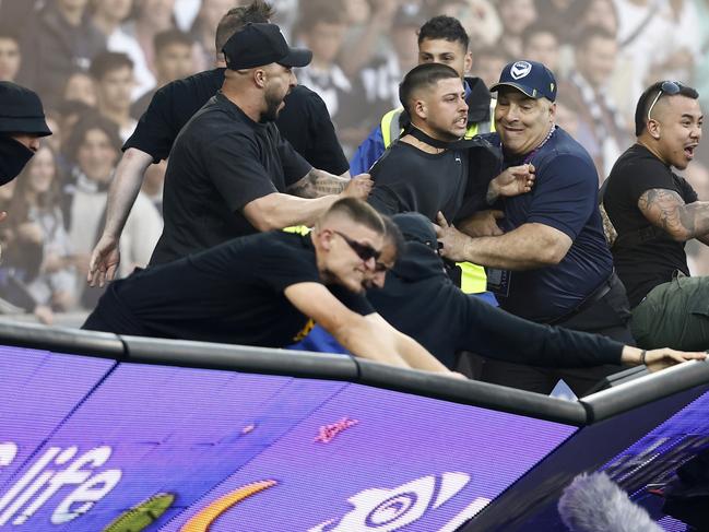 *APAC Sports Pictures of the Week - 2022, December 19* - MELBOURNE, AUSTRALIA - DECEMBER 17: Fans storm the pitch in protest during the round eight A-League Men's match between Melbourne City and Melbourne Victory at AAMI Park, on December 17, 2022, in Melbourne, Australia. (Photo by Darrian Traynor/Getty Images)