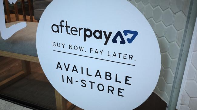 An Afterpay sign is seen in a store window in a shopping centre. Picture: AAP