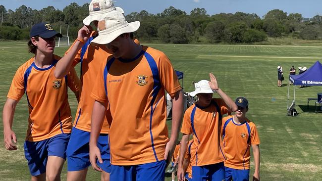 Marist College Ashgrove players leave the field after winning the premiership.