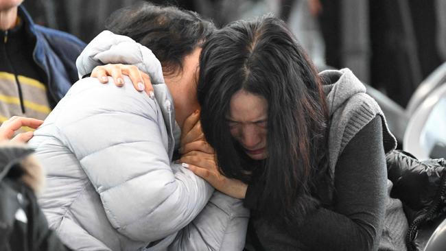 Relatives of passengers of the Jeju Air camped out in a make-shift shelter at Muan International Airport. Picture: Jung Yeon-Je/AFP