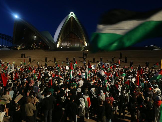 SYDNEY, AUSTRALIA - OCTOBER 09: Palestine supporters rally outside the Sydney Opera House on October 09, 2023 in Sydney, Australia. The Palestinian militant group Hamas launched a surprise attack on Israel from Gaza by land, sea, and air, over the weekend, killing over 600 people and wounding more than 2000, agency reports said. Reports also said Israeli soldiers and civilians have been kidnapped by Hamas and taken into Gaza. The attack prompted a declaration of war by Israeli Prime Minister Benjamin Netanyahu, and ongoing retaliatory strikes by Israel on Gaza killing hundreds in the aftermath. (Photo by Lisa Maree Williams/Getty Images)