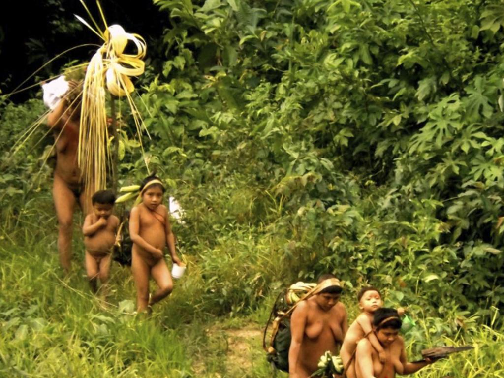 Members of the Korubo tribe walk along a path in the Javari Valley, in the northern state of Amazonas, Brazil. Picture: FUNAI