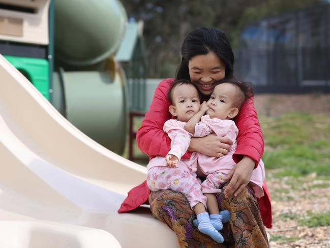 Mum Bhumchu Zangmo hold Nima [left], and Dawa [right] at the Children First Foundation Miracle Smiles Retreat in Kilmore. Picture: Alex Coppel