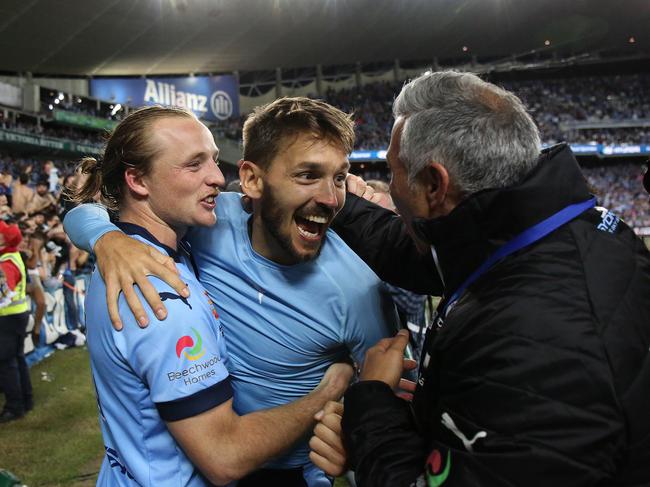 Milos Ninkovic, centre, after winning the A-League grand final in 2017